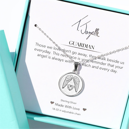 The Guardian Sterling Silver Charm Necklace by T Jazelle features angel wings and a heart-shaped gem, displayed in a turquoise gift box with a heartfelt guardianship message—an ideal Guardian Angel Charm gift.