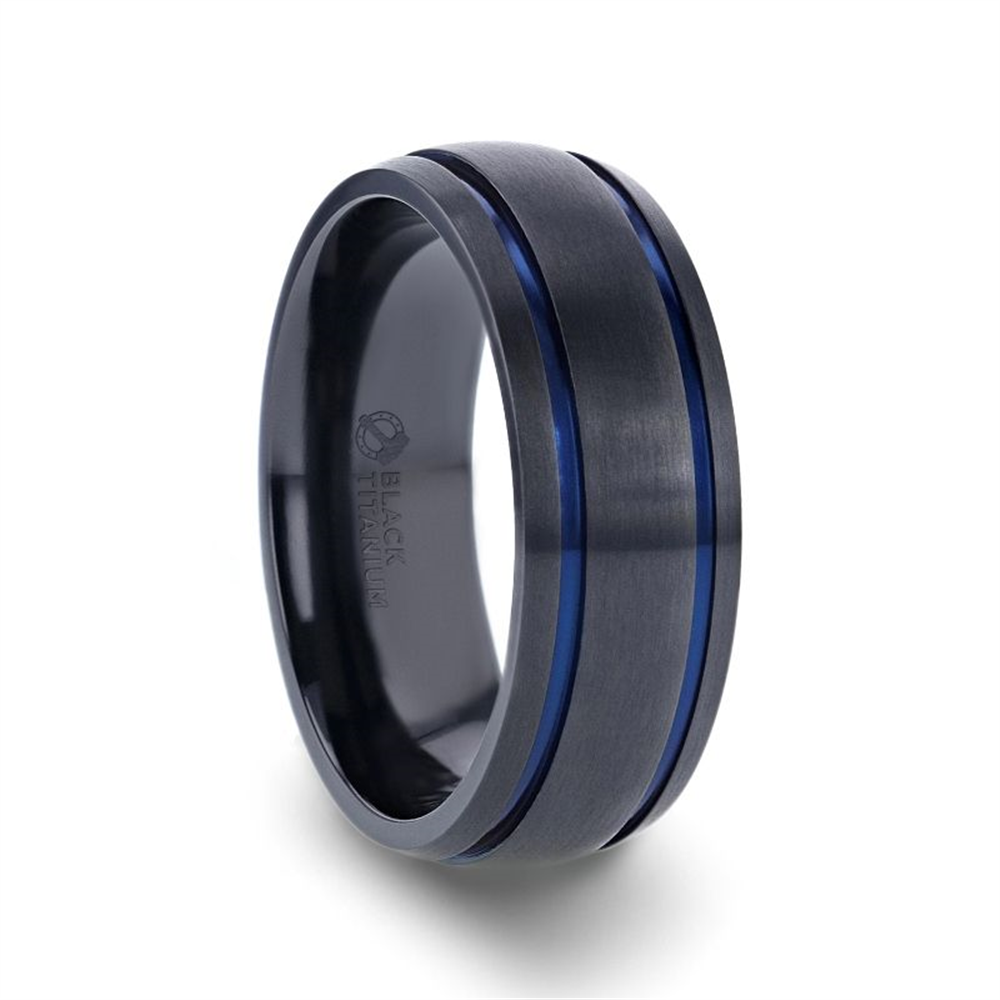 Introducing the SHERIFF by Thorsten: a sleek black titanium men's wedding ring featuring two thin blue grooves circling its circumference. The words "BLACK TITANIUM" are subtly engraved on the inside of the band. This ring boasts a modern and sophisticated design with a brushed finish.
