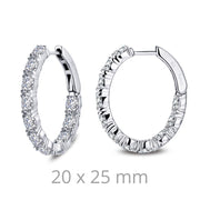 Introducing the 4.4cts Diamonds Oval Hoop Earrings by Lafonn – a stunning pair of sterling silver hoops adorned with round and baguette-cut simulated diamonds. These earrings feature a convenient hinge closure and are displayed from various angles, showcasing their elegance. The dimensions, "20 x 25 mm," are noted below the earrings for your reference.