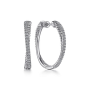 A pair of elegant, classic 925 Sterling Silver White Sapphire Twisted Bujukan 30mm Hoop earrings by Gabriel & Co. One earring is shown side-on, revealing a straight line of white sapphires, while the other is displayed in an open position showcasing the circular shape and intricate detailing.