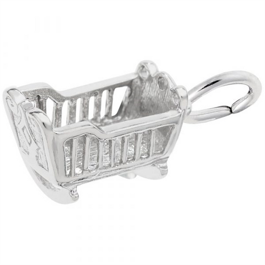 The Baby Cradle Charm in Sterling Silver by Rembrandt Charms boasts intricate detailing, including slatted sides and a small ring on top for easy attachment to a bracelet or necklace. Designed to resemble a classic rocking cradle, this charm features a shiny, polished finish.