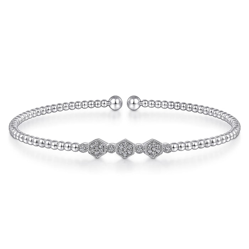Introducing the 14K White Gold Bujukan Bead and Hexagon Cluster Diamond Bangle by Gabriel & Co. This exquisite bangle features a delicate chain of small, round Bujukan beads and a striking centerpiece adorned with three diamond-studded hexagons. The bracelet is elegantly finished with two rounded bead clasps.