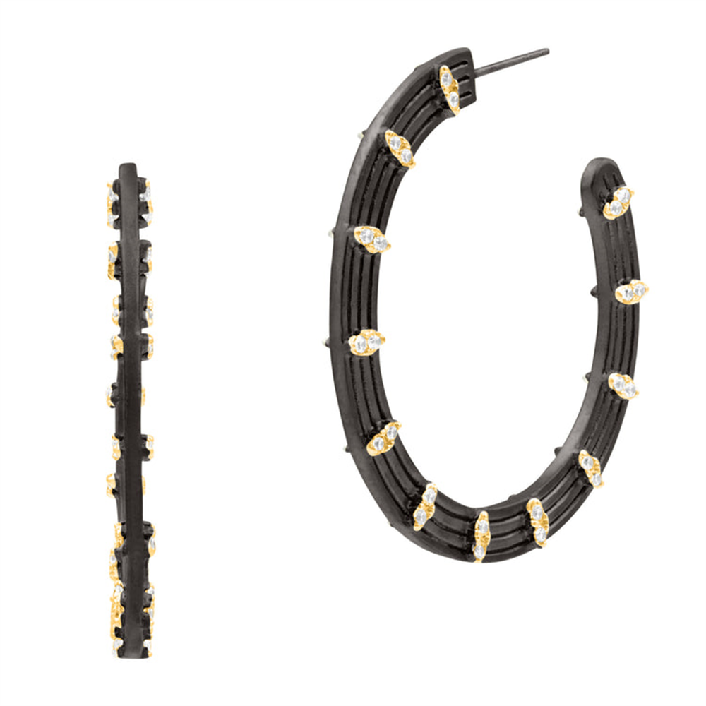The Freida Rothman FBYKZE42 Fleur Bloom EMPIRE Circular Statement Hoop Earrings feature black hoops with gold accents and clear teardrop gemstones, shown from side and front views on a white background.