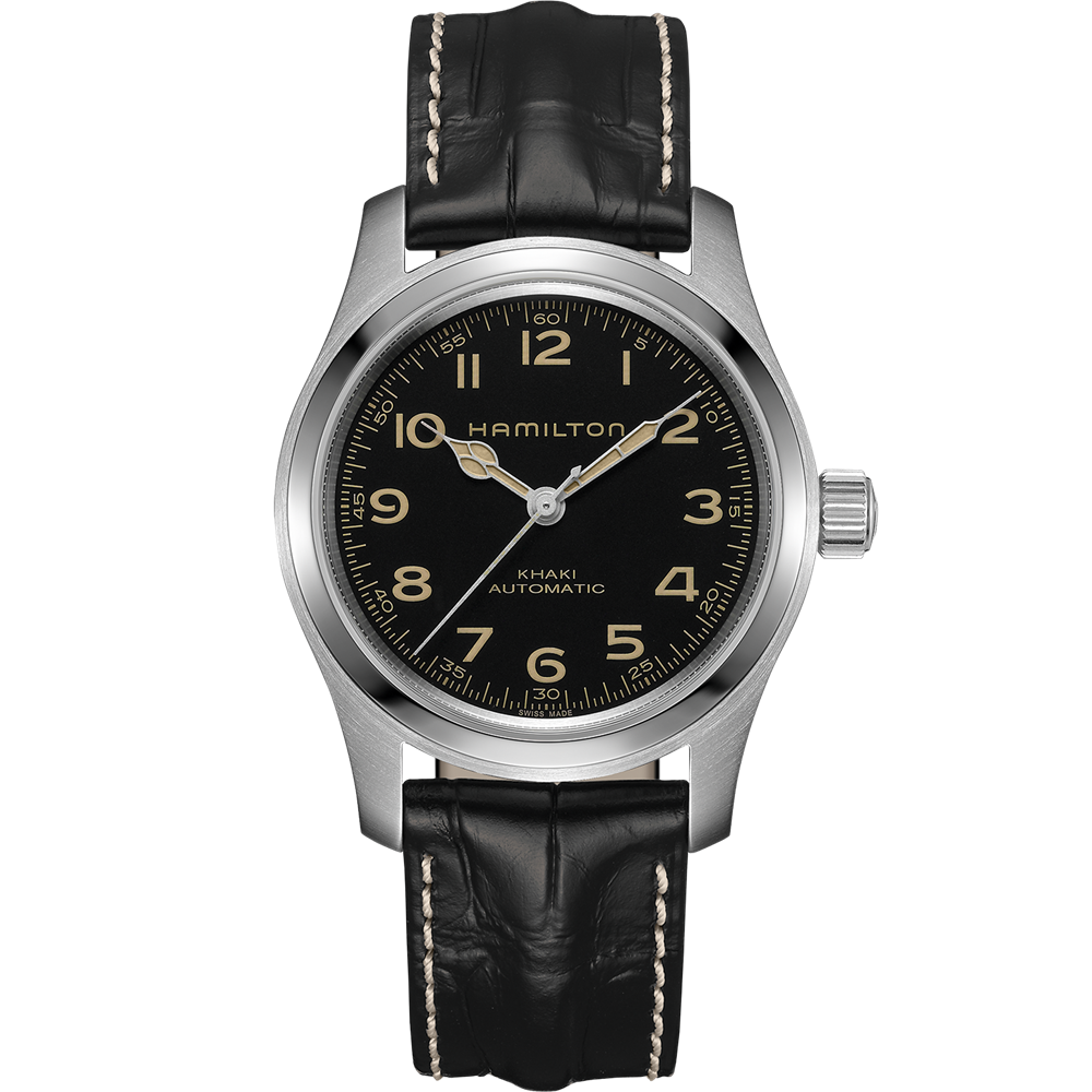 A KHAKI FIELD MECH GN NATO H50 / ZYH5Y4N62 Hamilton watch with a black dial featuring Arabic numerals and a date display at the 3 o'clock position. The watch has a silver stainless steel case and a black leather strap with white stitching, embodying rugged elegance distinctly present in every detail.