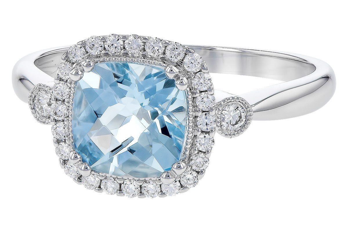 The Allison Kaufman 1.23ct Aquamarine ring features a 7mm cushion-cut aqua gemstone at the center, surrounded by a halo of white diamonds and more diamonds along each side of its elegant silver band.