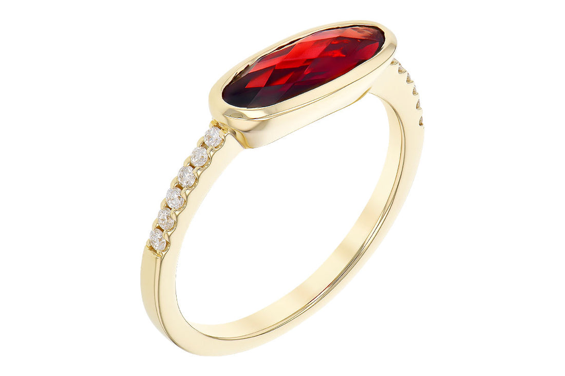 The Allison Kaufman 14K Yellow Gold Garnet and Diamond Ring showcases an elongated oval red garnet center with sparkling diamonds along the band—an elegant January birthstone.