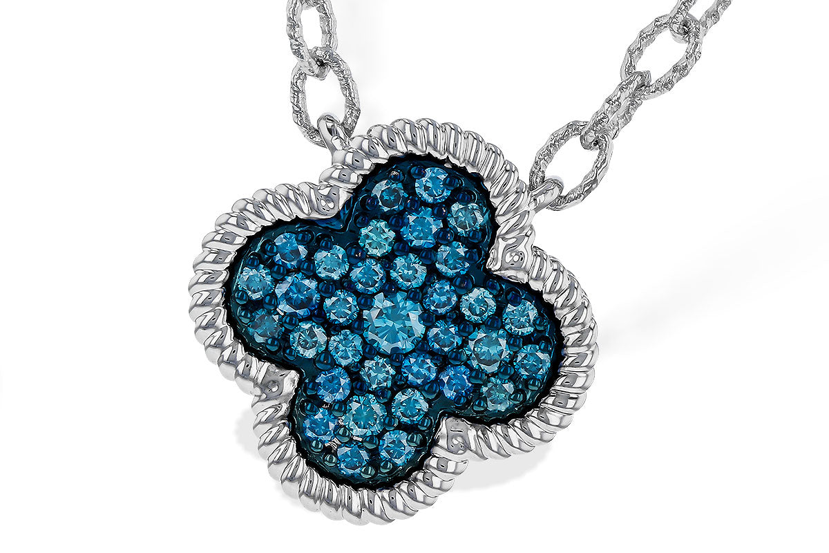 A close-up of the Allison Kaufman 14k white gold blue diamond necklace highlights its clover-shaped, blue diamond-encrusted pendant with a twisted border, elegantly suspended from a textured chain.