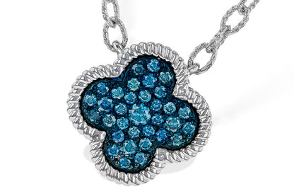 A close-up of the Allison Kaufman 14k white gold blue diamond necklace highlights its clover-shaped, blue diamond-encrusted pendant with a twisted border, elegantly suspended from a textured chain.