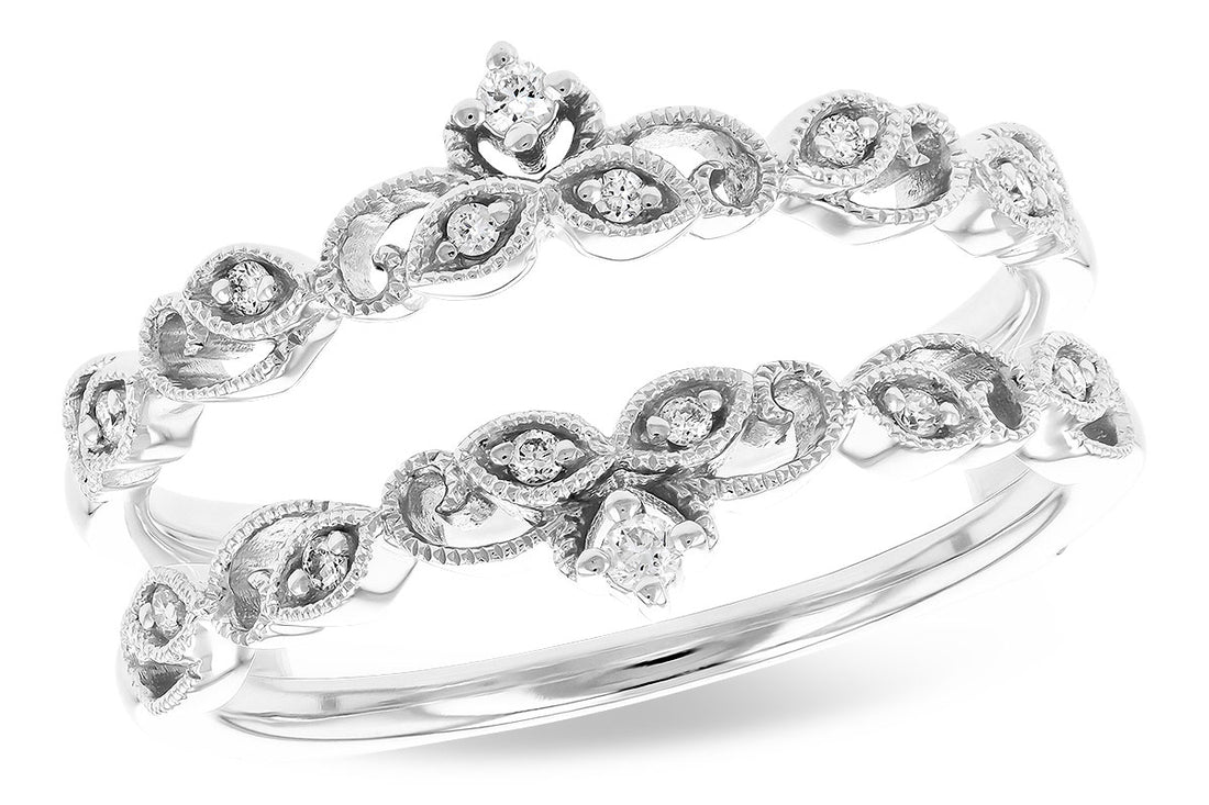 The Allison Kaufman 14K White Gold Diamond Ring Guard features two intricately designed rings with leaf-shaped motifs, set with small round diamonds and delicate detailing, shown on a white background.