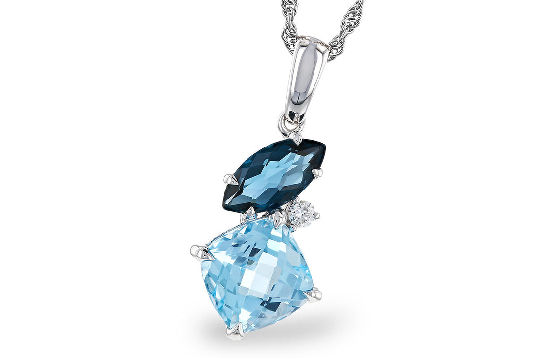 Introducing the Allison Kaufman Blue Topaz and Diamond Necklace, showcasing a striking diagonal arrangement of a dark blue marquise-cut topaz, a light blue cushion-cut topaz, and a small round white diamond, with a total weight of 2.37 TW.