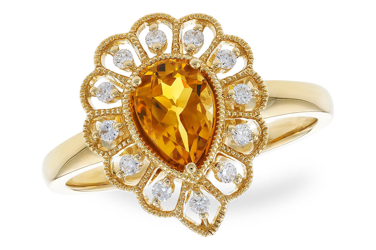 The Allison Kaufman 14K Yellow Gold Citrine and Diamond Ring features a pear-shaped yellow citrine center, accented by intricate gold details and sparkling round diamonds in a decorative, fan-like pattern.