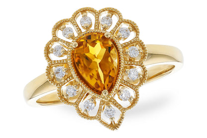 The Allison Kaufman 14K Yellow Gold Citrine and Diamond Ring features a pear-shaped yellow citrine center, accented by intricate gold details and sparkling round diamonds in a decorative, fan-like pattern.
