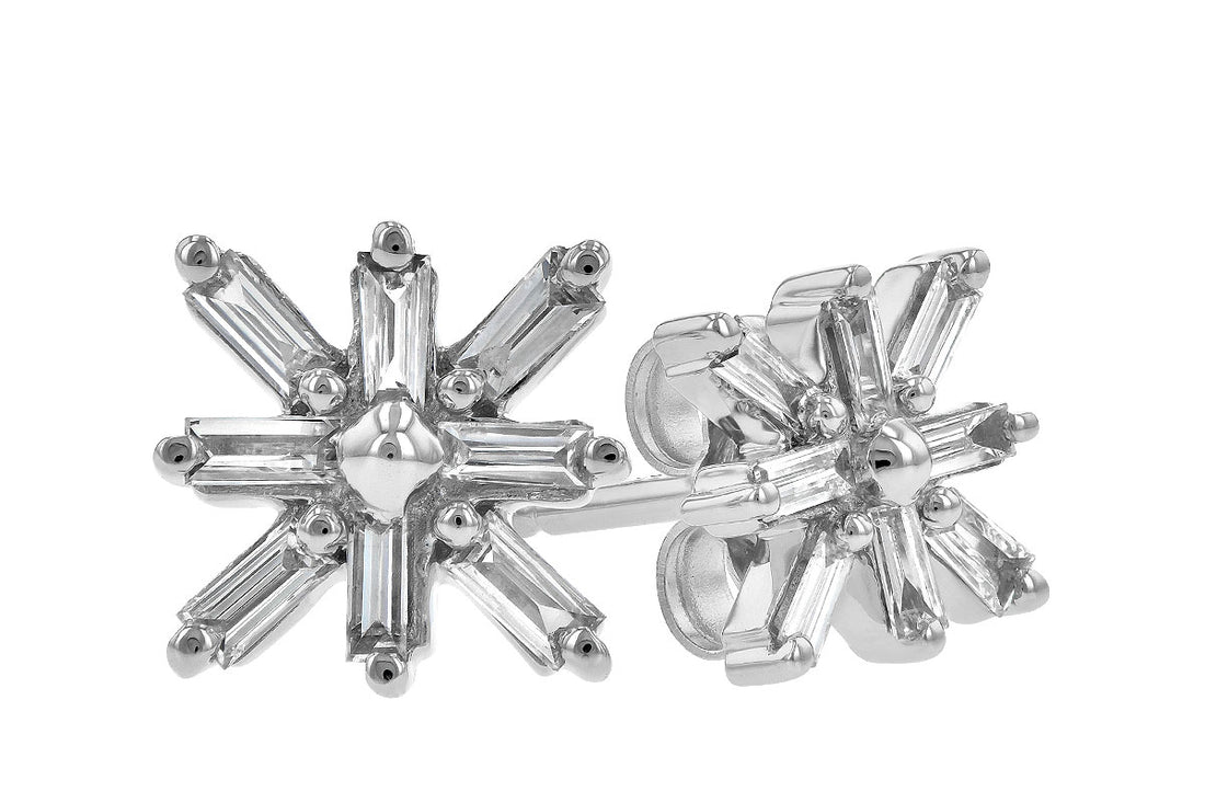 A pair of Snowflake Diamond Gold Earrings by Allison Kaufman in 14K white gold, showcasing six-point star-shaped studs with dazzling baguette-cut stones for a touch of elegance.
