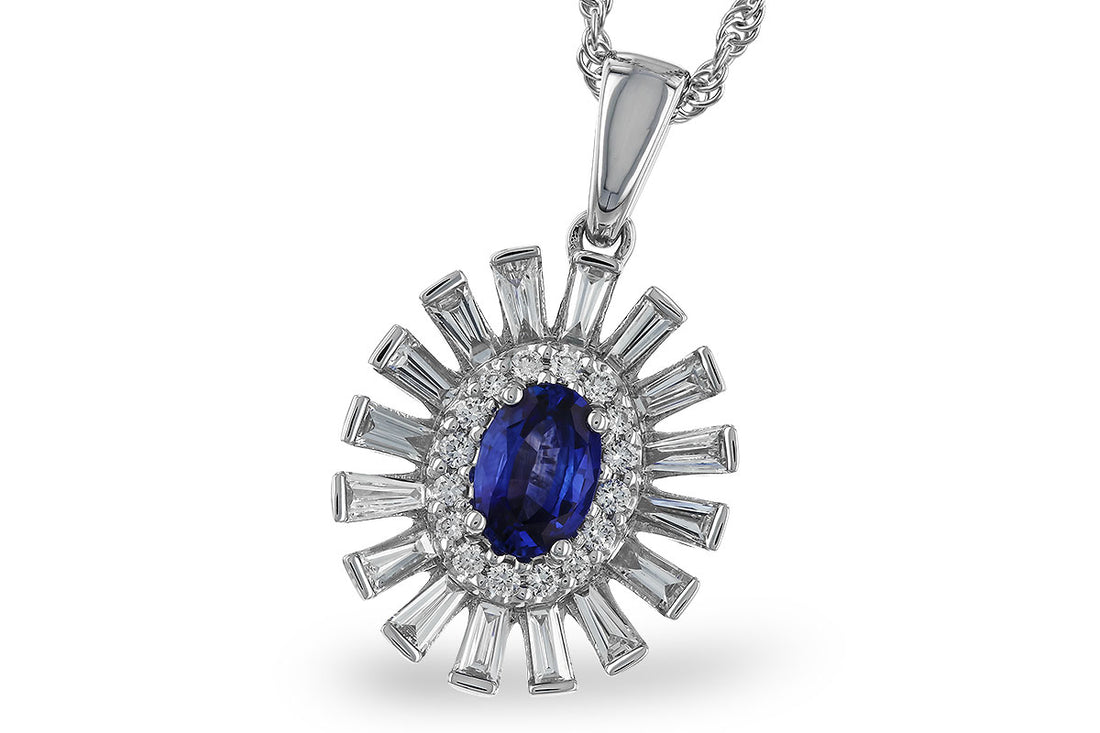 The Allison Kaufman 14K White Gold Sapphire and Diamond Pendant Necklace features an oval sapphire pendant surrounded by sparkling round and baguette-cut diamonds for a radiant sunburst effect.