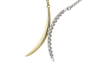 Close-up of the Allison Kaufman 14k two-tone diamond pendant: polished yellow and white gold, both set with round diamonds on delicate chains—a stunning piece of fine jewelry.