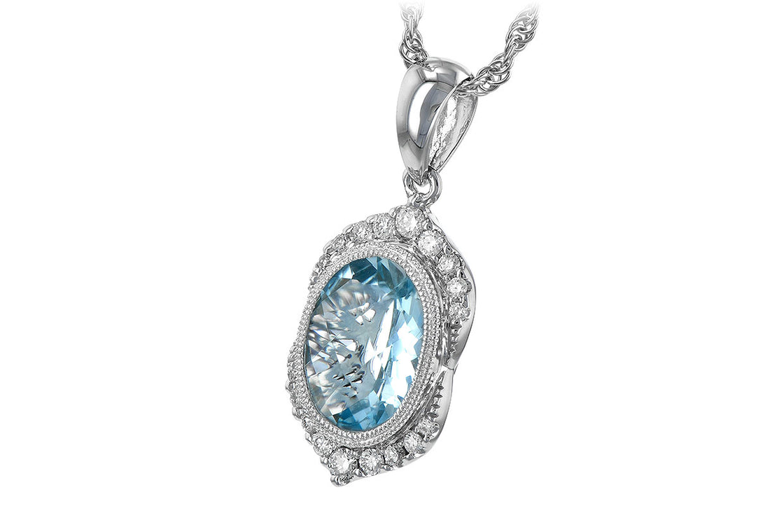The Allison Kaufman 14K Gold Aquamarine & Diamond Necklace features an oval aquamarine gem encircled by sparkling diamonds, set in detailed 14K gold, and suspends elegantly from a textured gold chain.