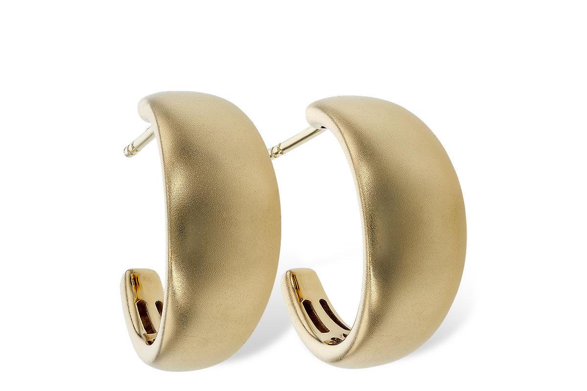 The Allison Kaufman 14K Yellow Gold Thick Half Hoop Earrings feature a chunky, sculptural design with a smooth matte finish, shown on a white background.