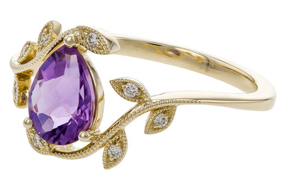The Allison Kaufman 14 Y Ladies Ring Amethyst features a large pear-shaped amethyst center, accented by leaf-like gold details and small round diamonds.
