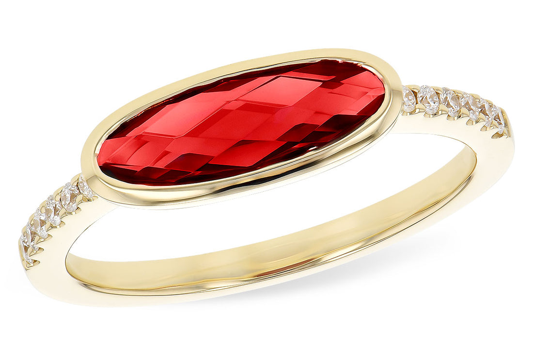 The Allison Kaufman 14K Yellow Gold Garnet and Diamond Ring features an elongated oval red garnet with a faceted surface, accented by sparkling diamonds along the band.