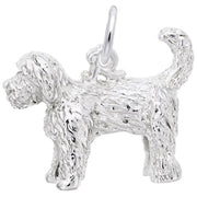 A close-up image of the Rembrandt Charms Labradoodle Dog Charm in sterling silver, designed to resemble a shaggy-coated dog. The charm displays detailed texture to mimic fur and features a loop at the top for attaching to a bracelet or necklace. The dog's tail is raised and curled.
