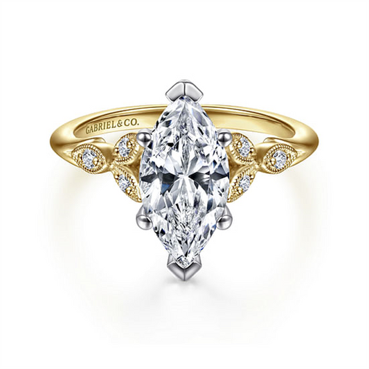 This 14K two-tone diamond engagement ring by Gabriel & Co. features a 12x6mm head, a marquise-cut center diamond accented with round diamonds and leaf designs, and an engraved band. Size 6.5.