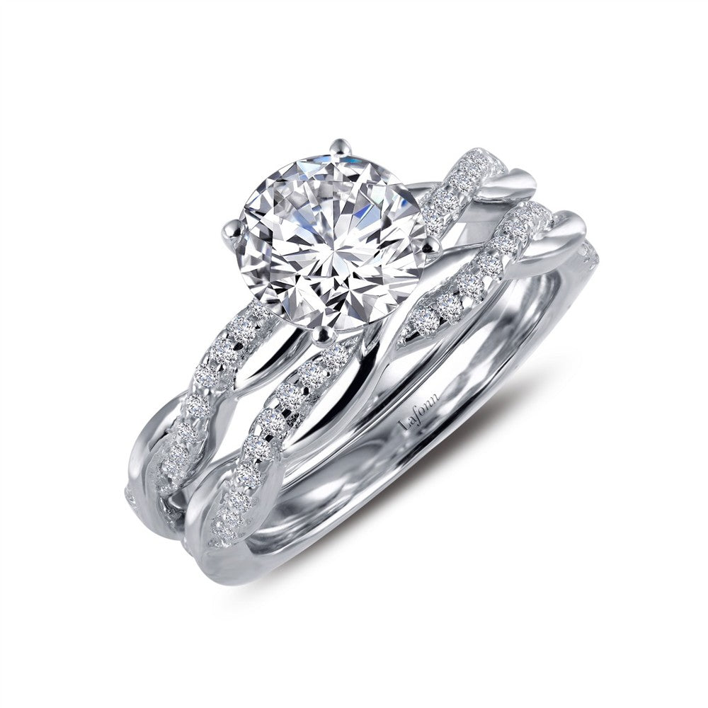 The Lafonn Engagement Ring with Wedding Band, size 4, features a large round center stone and intertwining bands set with sparkling accents, creating an elegant design perfect for both engagement and wedding.