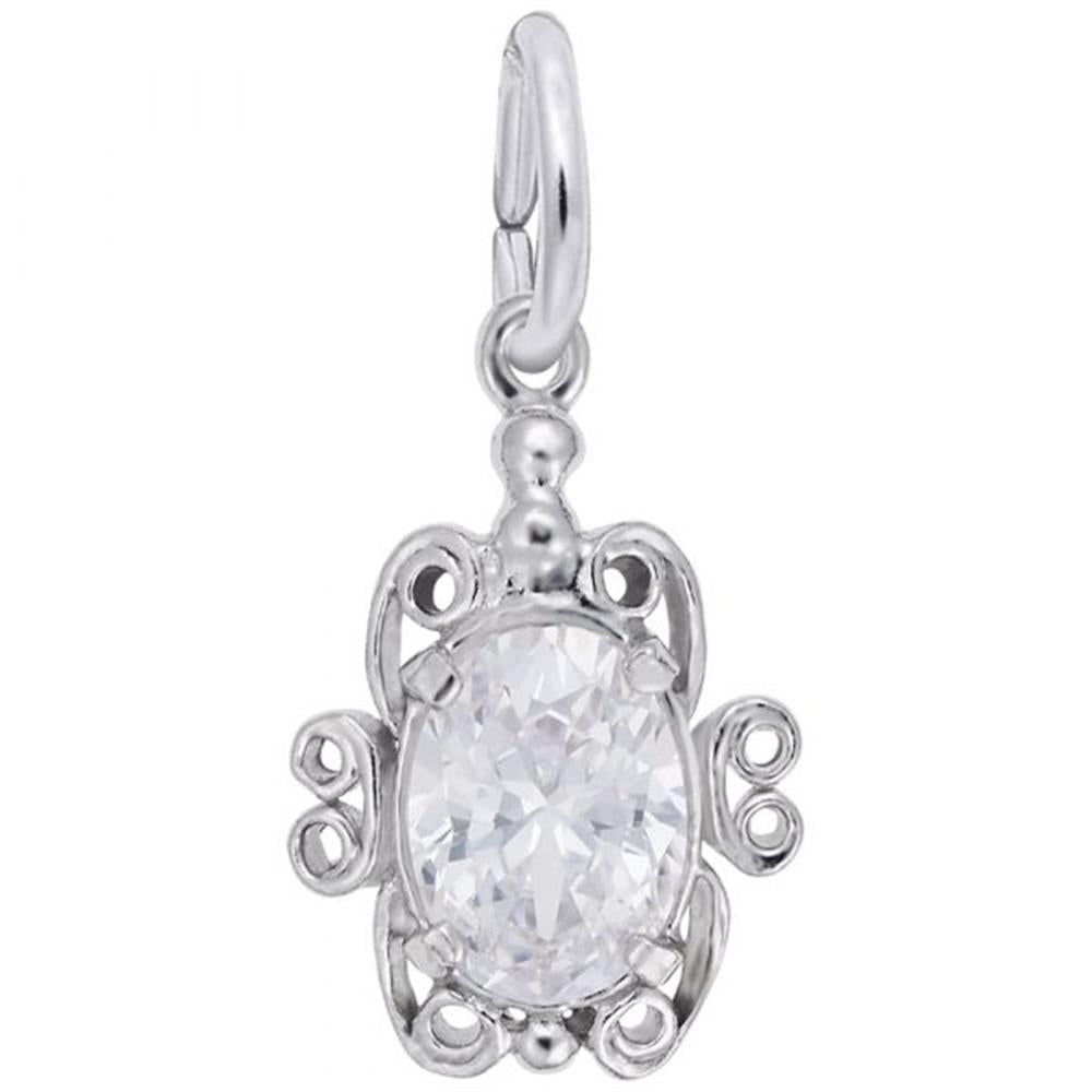 This sterling silver Filigree April Birthstone Charm by Rembrandt Charms is a decorative pendant shaped like a turtle, featuring an ornate design with curving details. The centerpiece is an oval-cut, clear gemstone resembling a diamond, encased in the turtle's body. It includes a small loop for attaching to a chain.