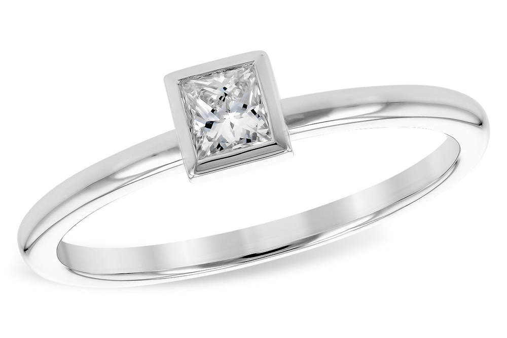 A close-up of the 14K Solitaire Ring with Princess-Cut Diamond by Allison Kaufman, showcasing its sleek and minimalist design. Crafted from polished 14K white gold, this ring features a square-shaped princess-cut diamond set in a bezel setting on a plain band. The brilliant cut of the diamond adds an elegant touch to this exquisite piece.