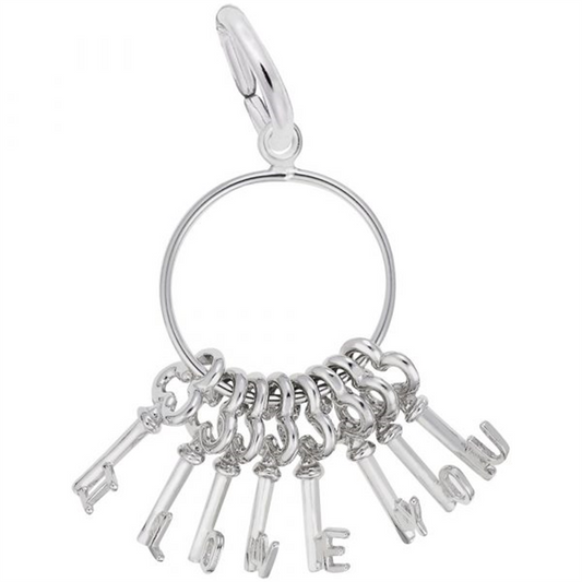 The Rembrandt Charms "I Love You Skeleton Key Ring" is a sterling silver keyring featuring dangling letter charms that spell out "I LOVE YOU." The charms are attached to a circular ring with a clasp at the top for easy attachment.