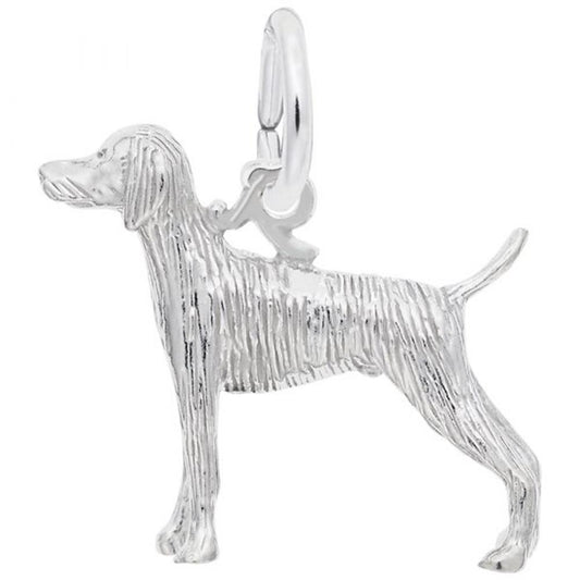 The Weimaraner Dog Charm from Rembrandt Charms is crafted in sterling silver and features intricate textured detailing. This handcrafted jewelry piece depicts a Weimaraner dog standing in profile, facing left, with its tail pointing upwards and head slightly forward. It includes a loop for easy attachment to a necklace or bracelet.