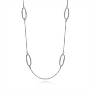 Introducing the Sterling Silver Bujukan Station Necklace | 32" by Gabriel & Co, an elegant piece from the exclusive Bujukan Collection. This sophisticated necklace features a delicate chain adorned with an alternating pattern of elongated oval links, each composed of smaller interwoven loops.