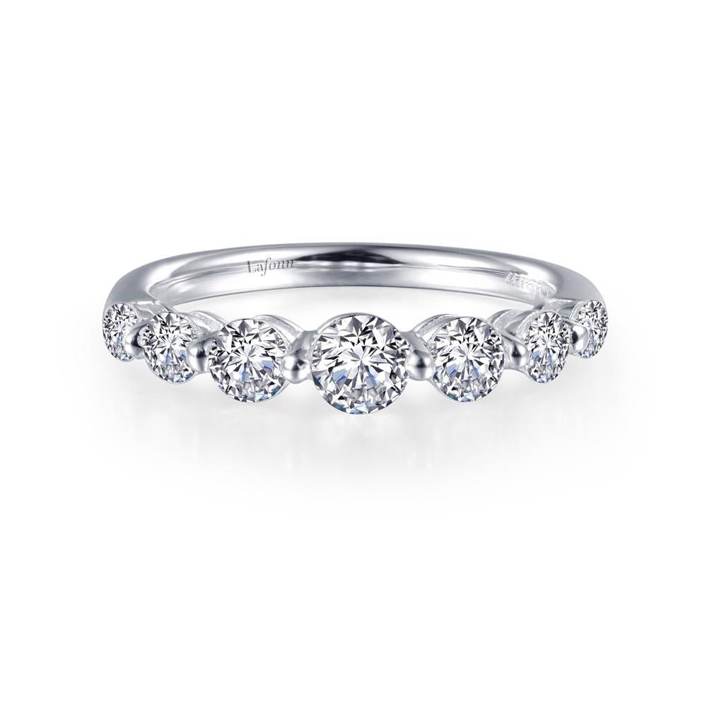 Introducing the Lafonn 7 Symbols of Joy Half Eternity Band: a delicate silver ring featuring a symmetrical row of nine sparkling round-cut diamonds in varying sizes. This elegant half eternity band, available in size 6, is adorned with the 7 Symbols of Joy and crafted from exquisite white metal.

