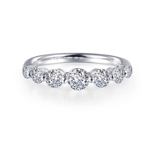 Introducing the Lafonn 7 Symbols of Joy Half Eternity Band: a delicate silver ring featuring a symmetrical row of nine sparkling round-cut diamonds in varying sizes. This elegant half eternity band, available in size 6, is adorned with the 7 Symbols of Joy and crafted from exquisite white metal.

