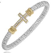 The 4MM Closed Band by Alwand Vahan Jewelry, available in Size B4 (23449D04), features a striking silver bracelet with a prominent gold-accented cross studded with 0.13ct diamonds at its center. The band is composed of shiny, interlinked loops and adorned with two gold accents flanking the cross, giving it an elegant and reflective finish.