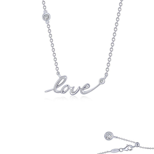 The Love Word Necklace by Lafonn is a delicate sterling silver piece with the word "love" elegantly spelled out in cursive script. Two Lassaire simulated diamonds are embedded on the chain, one on each side of the word. This necklace, bonded with platinum, features a simple clasp closure at the back.