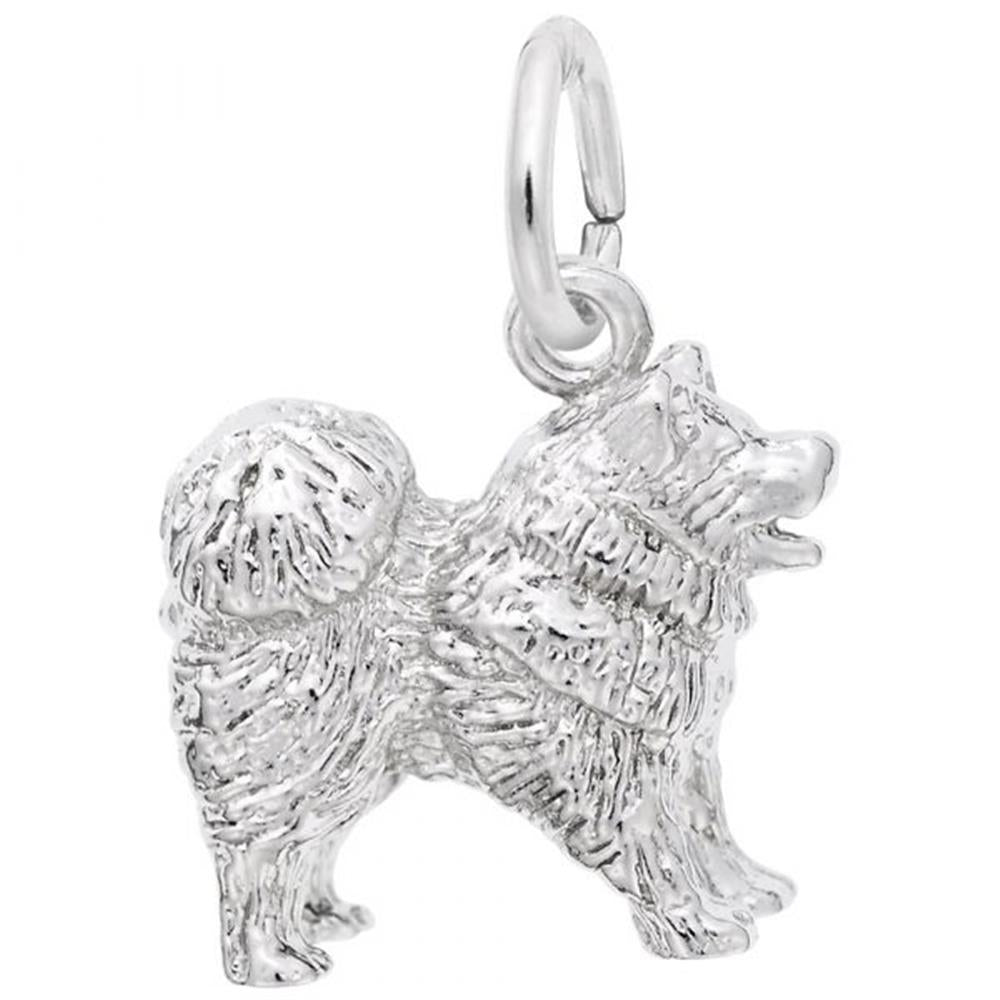 The Rembrandt Charms Chow Chow Dog Charm in Sterling Silver is a detailed piece designed as a fluffy dog with a curly tail, standing on all fours. It features a small loop on top for attaching to a bracelet or necklace, with the fur textured to give the dog a realistic appearance.