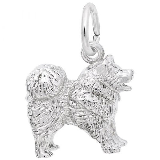 The Rembrandt Charms Chow Chow Dog Charm in Sterling Silver is a detailed piece designed as a fluffy dog with a curly tail, standing on all fours. It features a small loop on top for attaching to a bracelet or necklace, with the fur textured to give the dog a realistic appearance.