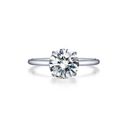 The Lafonn Solitaire Engagement Ring 2.0 ctw Round Size 7 showcases a stunning, minimalist design with a 2.0 carat total weight, round-cut diamond set in a sleek white metal band. The gem is securely held by four prongs, and the delicate size 7 band enhances the diamond's brilliance against a plain white backdrop.