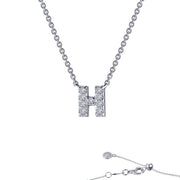 The Letter H Pendant Necklace from Lafonn is a stunning piece of jewelry. It showcases a pendant shaped like the letter "H," adorned with small, sparkling crystals. The fine and delicate chain ends with a clasp and an adjustable segment featuring a small crystal charm at the end.