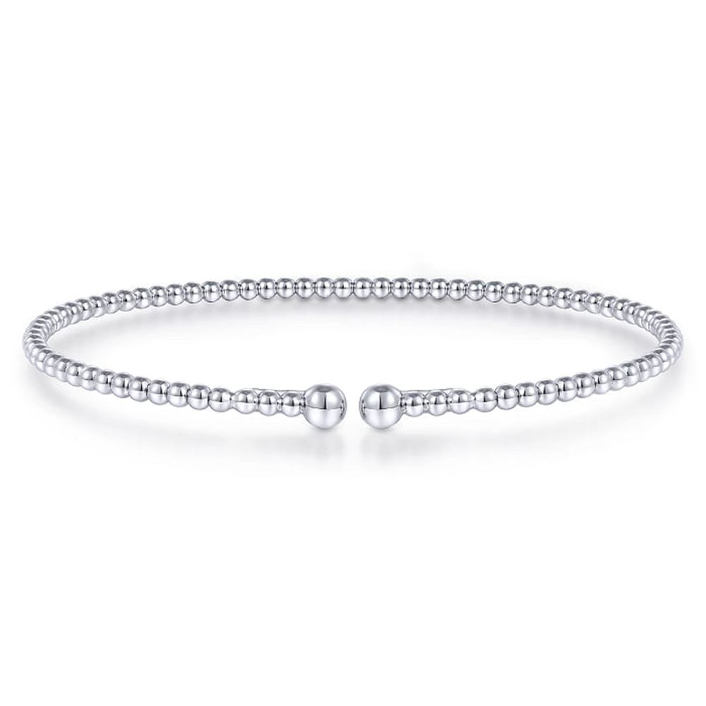 A delicate beaded bracelet with a minimalist design, featuring evenly spaced small round beads. The Gabriel & Co 14K White Gold Bujukan Split Bangle, sized at 6.25, is circular and appears to be flexible, with a gap at the front held by two slightly larger bead ends. The background is white and plain.