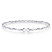 A delicate beaded bracelet with a minimalist design, featuring evenly spaced small round beads. The Gabriel & Co 14K White Gold Bujukan Split Bangle, sized at 6.25, is circular and appears to be flexible, with a gap at the front held by two slightly larger bead ends. The background is white and plain.