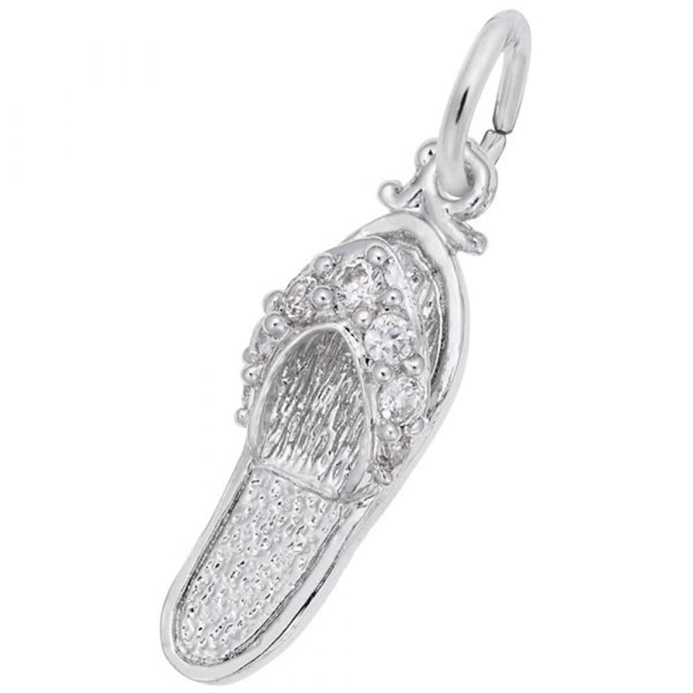 A close-up of the Rembrandt Charms "Sandal with CZ Charm" sterling silver pendant showcases intricate detailing, including bead-like patterns on the upper part. The pendant features a small loop at the top for attaching to a necklace or bracelet.