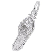 A close-up of the Rembrandt Charms "Sandal with CZ Charm" sterling silver pendant showcases intricate detailing, including bead-like patterns on the upper part. The pendant features a small loop at the top for attaching to a necklace or bracelet.