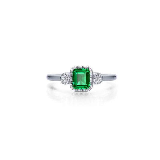 The Lafonn size 7 emerald ring features a square-cut green center stone flanked by two round clear stones, showcased on a plain white background.