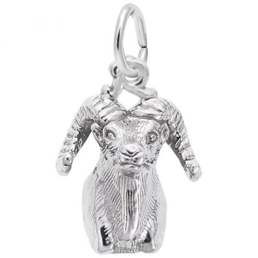Introducing the Big Horn Sheep Head Charm in Sterling Silver by Rembrandt Charms. This pendant boasts detailed facial features and curved horns, enhanced with an intricate design that beautifully captures the texture of the ram's fur and horns. Featuring a circular loop at the top, it is perfect for attaching to a necklace or bracelet.