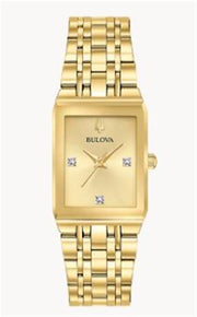 Bulova Watch Company’s Quadra Modern 97P140 is a gold tone rectangular ladies watch with a gold face and four diamond markers at 12, 3, 6, and 9 o'clock.