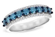 The Allison Kaufman LDS DIA RG .80 TW BLUE DIAS 1.00 TW features a polished silver band, round blue diamonds set between two rows of small clear diamonds, and dark prongs securing the blue stones.