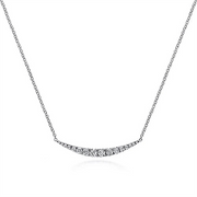 Introducing the 14K White Gold Curved Diamond Bar Necklace from Gabriel & Co's Kaslique Collection, showcasing a thin chain and a crescent-shaped pendant adorned with small, sparkling diamonds. The simple and elegant design centers the pendant, creating a focal point of subtle brilliance.