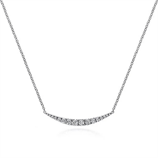 Introducing the 14K White Gold Curved Diamond Bar Necklace from Gabriel & Co's Kaslique Collection, showcasing a thin chain and a crescent-shaped pendant adorned with small, sparkling diamonds. The simple and elegant design centers the pendant, creating a focal point of subtle brilliance.