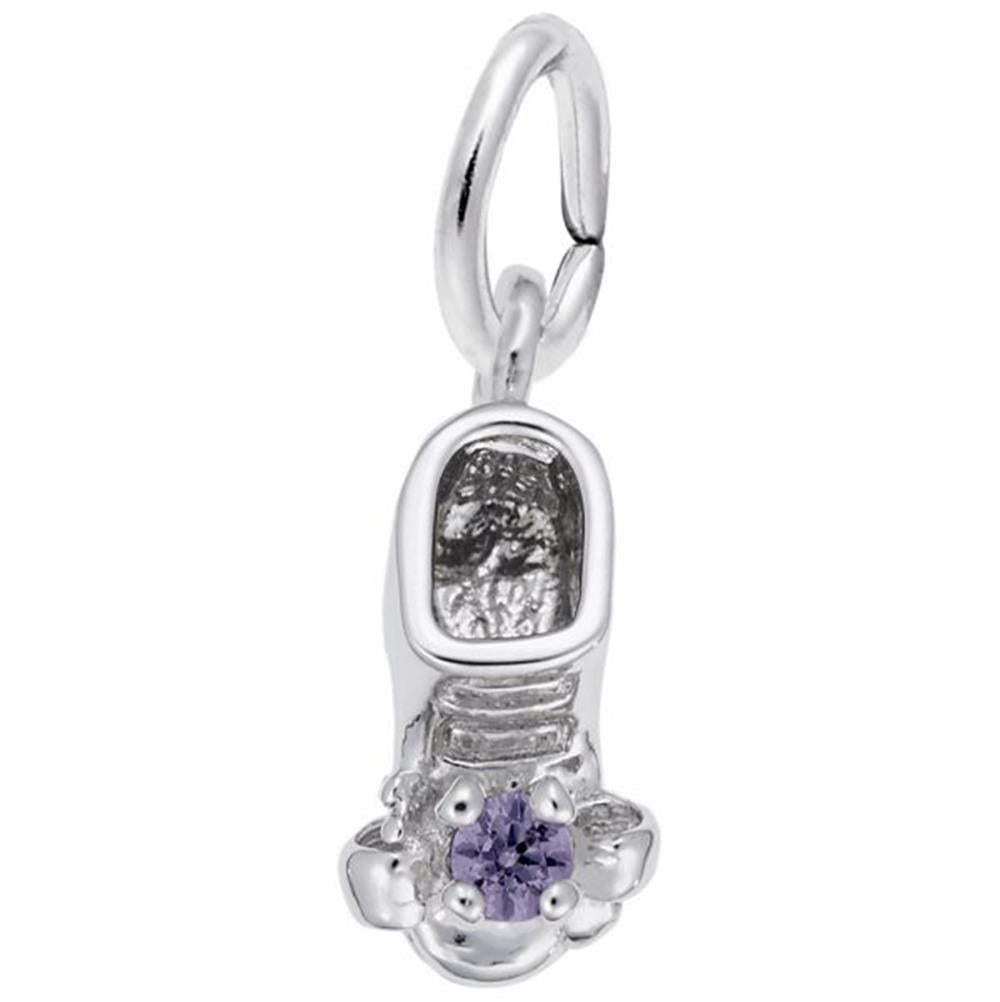 A close-up image of Rembrandt Charms' June Baby Bootie Charm in sterling silver, adorned with a purple gemstone on top. This charm features a loop at the top for attaching to a bracelet or necklace, and boasts intricate detailing including laces and texture on the inside.